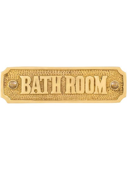 Cast Brass Bathroom Sign in Polished Brass.